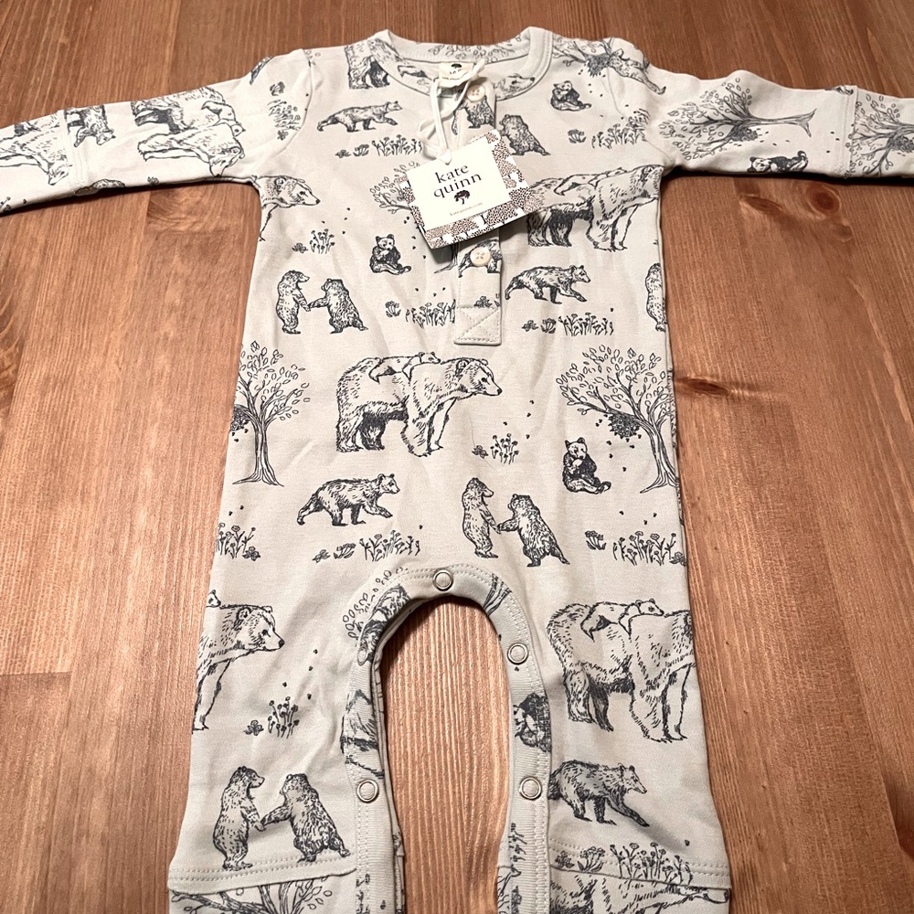 Light blue bear/nature themed one piece from Kate Quinn. Brand new w/ tags.